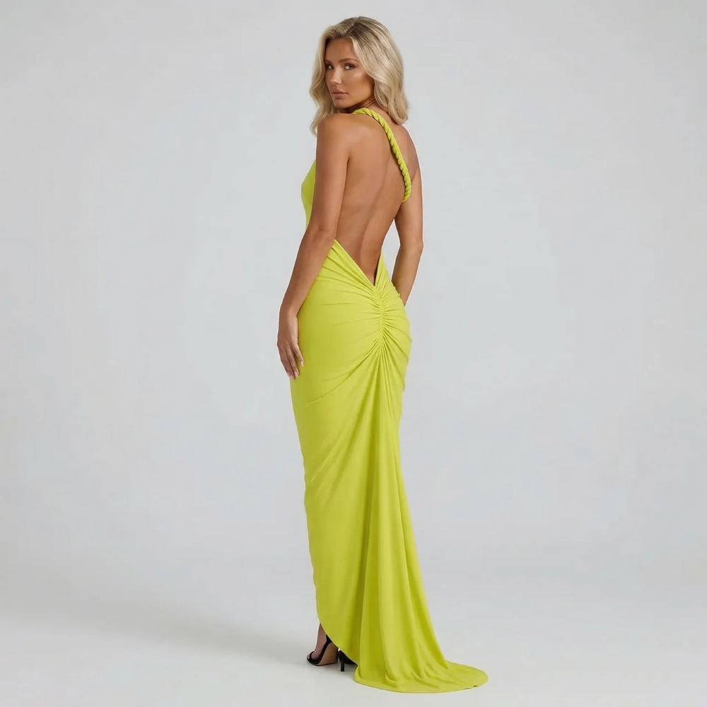 Green ruched maxi dress — back view highlighting open back design with gathered draping detail.