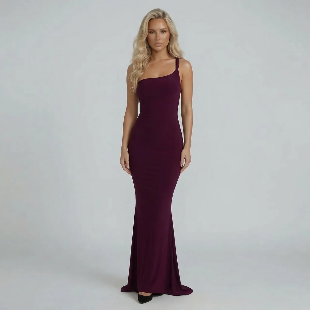 Burgundy ruched maxi dress with asymmetric neckline and sculpted fit — front view on model with flowing hem.