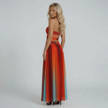 Ombre cutout maxi dress — side view highlighting the dramatic red-to-teal color gradient.