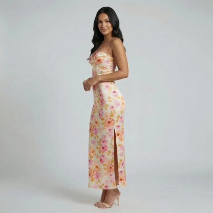 Yellow floral maxi dress with sweetheart neckline and side slit — side angle shot.