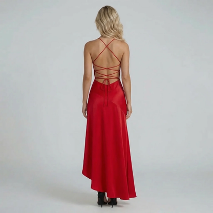 Red lace-up back maxi dress with ruffled hem — back view emphasizing the open-back detail and adjustable tie straps.