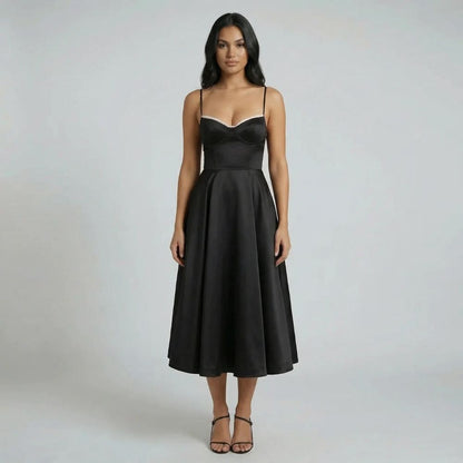 Black fit-and-flare midi dress with sculpted bodice and flowing skirt — front view.