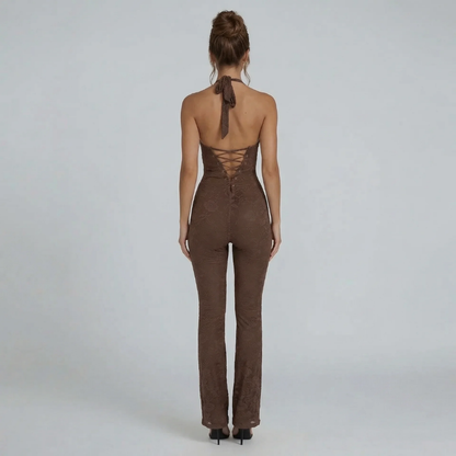 Brown lace halter jumpsuit with lace-up back detail and flattering flare — back view.