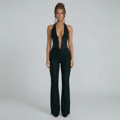 Black lace halter jumpsuit with corset-inspired cutouts and flared legs — front view.