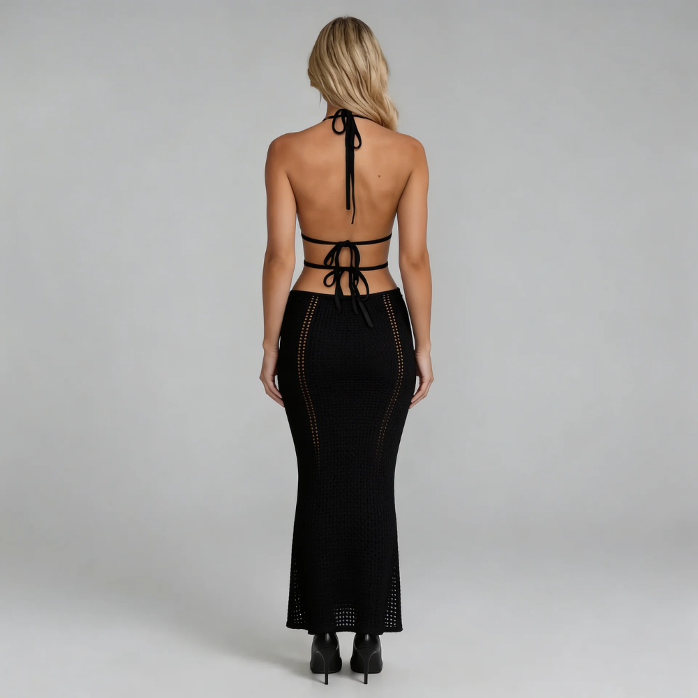 Black crochet cutout halter maxi dress — back view focusing on daring open-back tie design.
