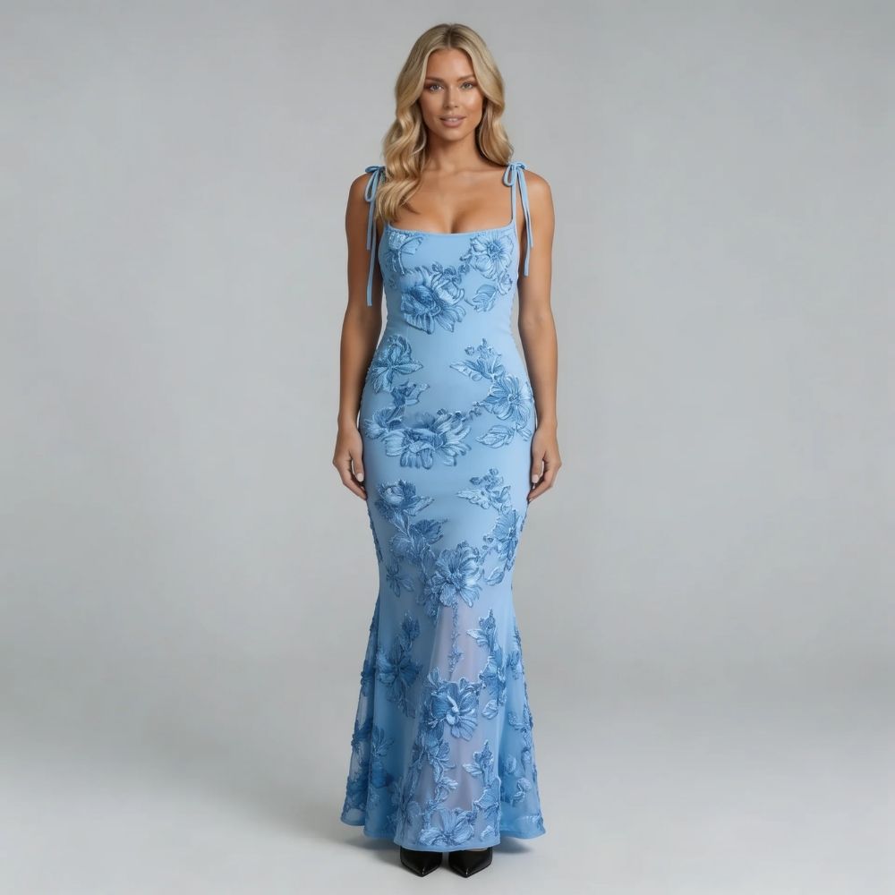 White floral maxi dress with raised floral texture — model styled for a garden party look.