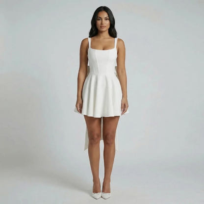 White fit-and-flare mini dress styled with heels, front view highlighting square neckline