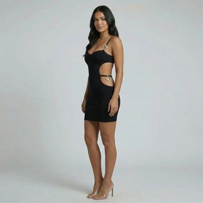 Black cutout bodycon mini dress — side view showing waist cutouts and fitted silhouette.