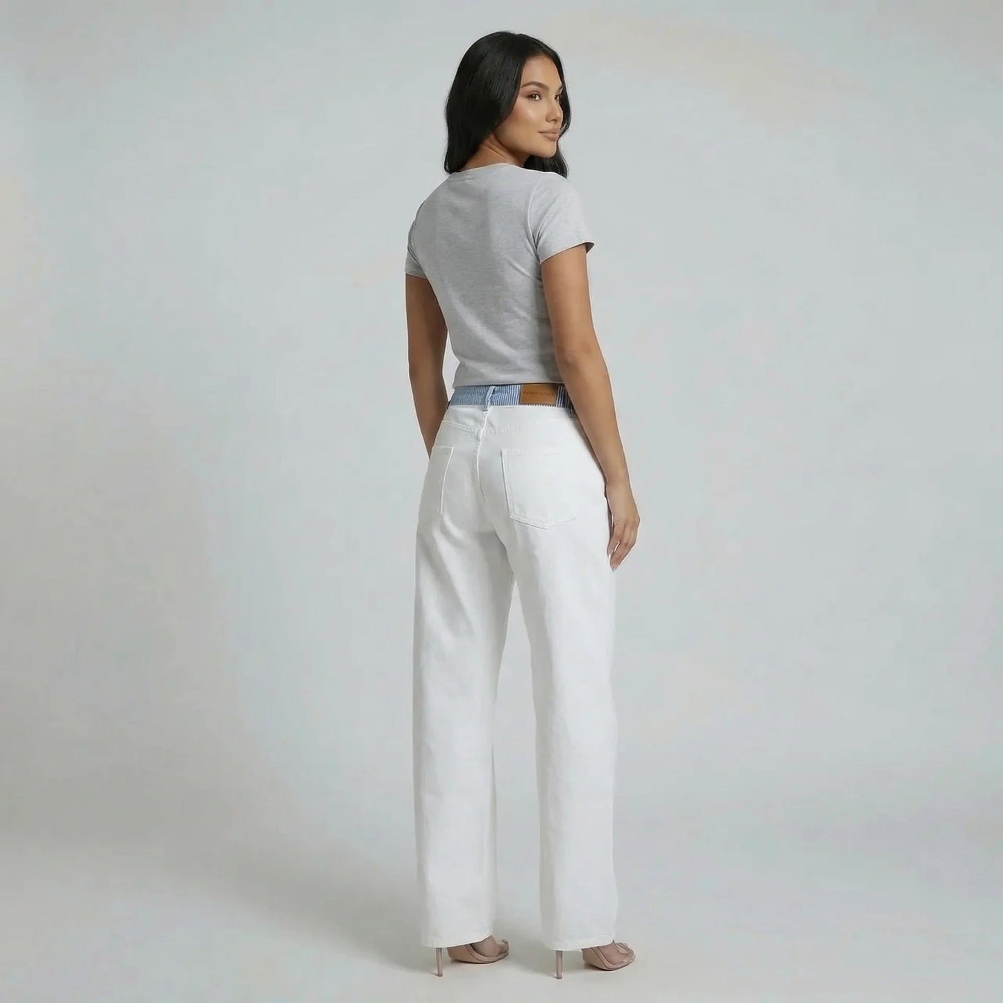 White wide-leg jeans with striped waistband — side view accentuating relaxed silhouette