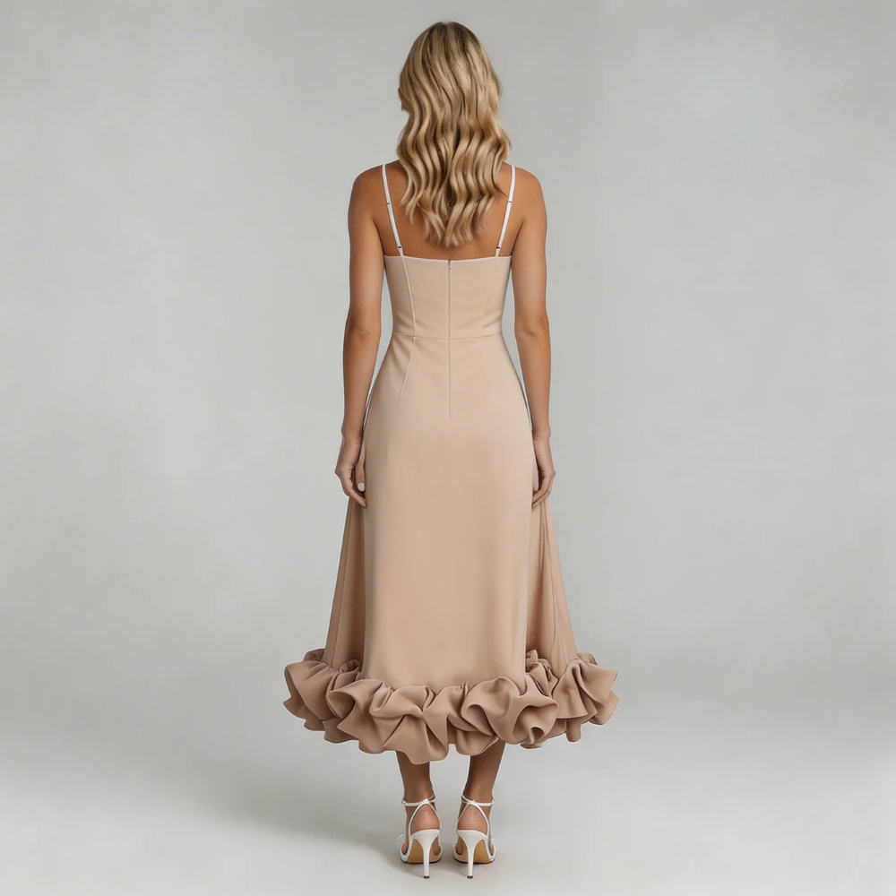 Back view of the champagne Hadley Ruffle Midi Dress, emphasizing the dramatic ruffled hem and thin straps.