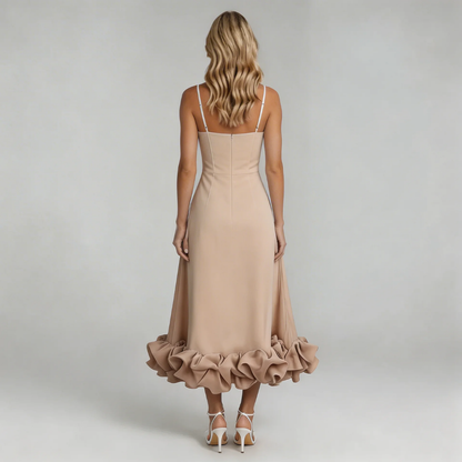 Back view of the champagne Hadley Ruffle Midi Dress, emphasizing the dramatic ruffled hem and thin straps.