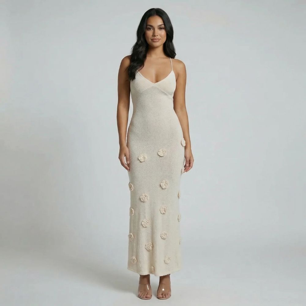 White maxi dress with 3D floral appliqués—front view showing versatility of design.