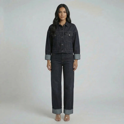 Dark wash navy cropped denim jacket with oversized sleeves and matching wide-leg jeans.