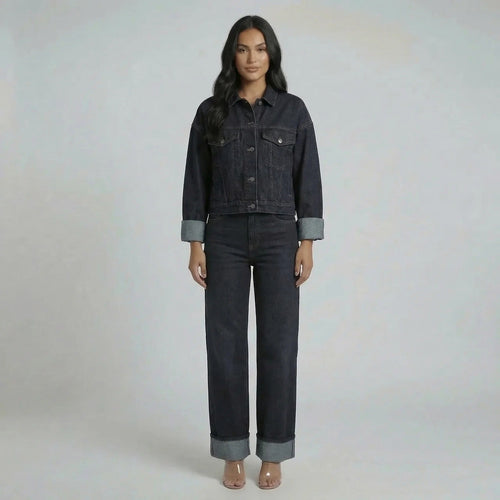 Dark wash navy cropped denim jacket with oversized sleeves and matching wide-leg jeans.