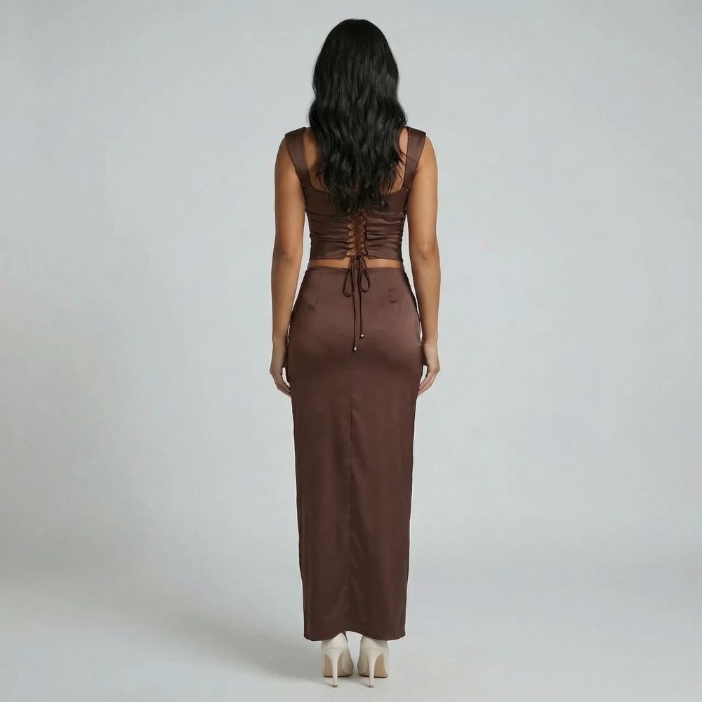 Brown ruched maxi dress with lace-up corset back detail — back view showcasing adjustable fit.
