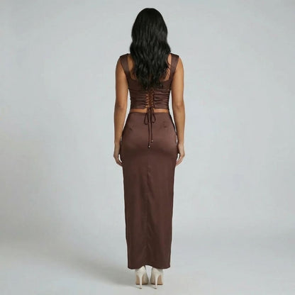 Brown ruched maxi dress with lace-up corset back detail — back view showcasing adjustable fit.