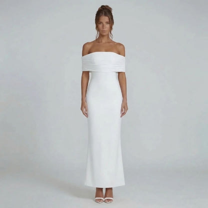 White off-shoulder ruched maxi dress with dramatic open back — front view highlighting sculpted silhouette.