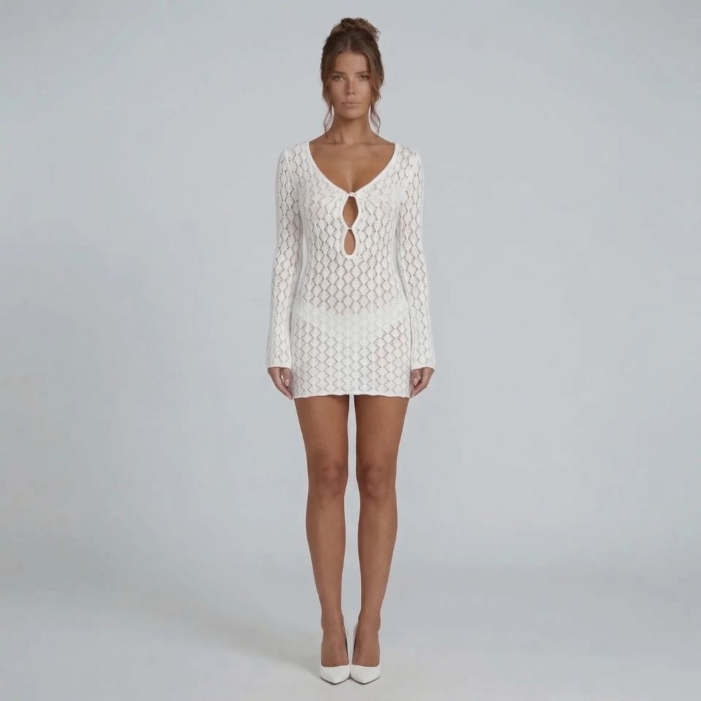White crochet mini dress with V-neckline and bell sleeves — front view.