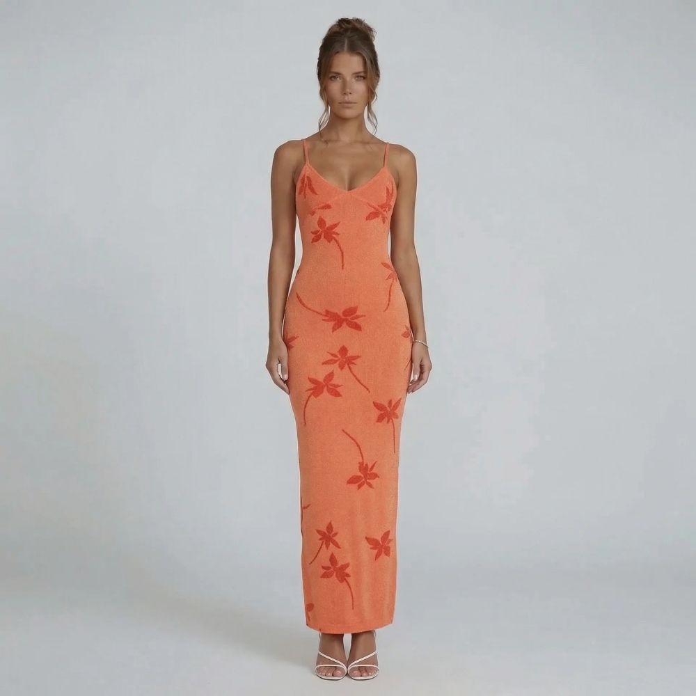 Orange floral knit maxi dress with scoop neckline and adjustable straps — front view showcasing the curve-skimming silhouette