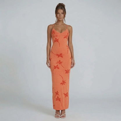 Orange floral knit maxi dress with scoop neckline and adjustable straps — front view showcasing the curve-skimming silhouette