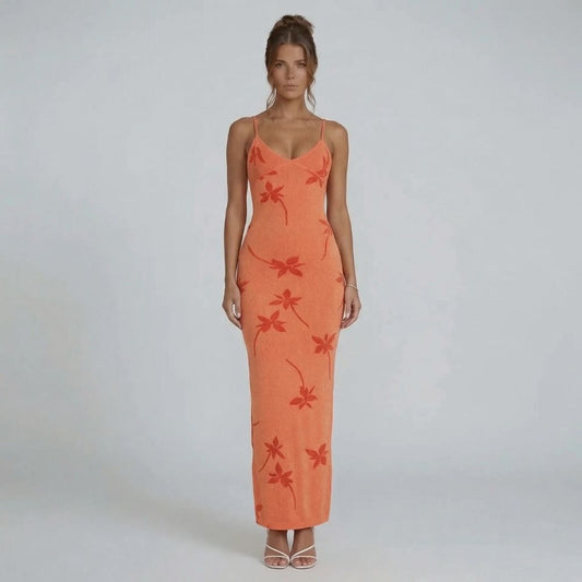 Orange floral knit maxi dress with scoop neckline and adjustable straps — front view showcasing the curve-skimming silhouette