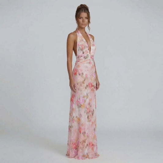 Blush floral halter maxi dress — front view showing flowing silhouette and flattering waistline.