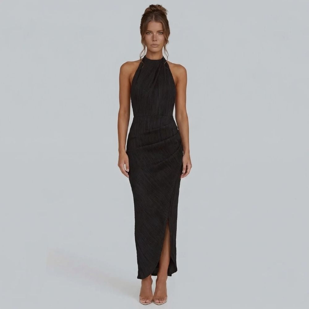 Black pleated maxi dress with halter neckline — front view showing wrap-effect skirt.