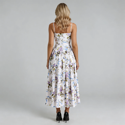Purple floral corset midi dress — back view showing zip closure and flowy skirt.