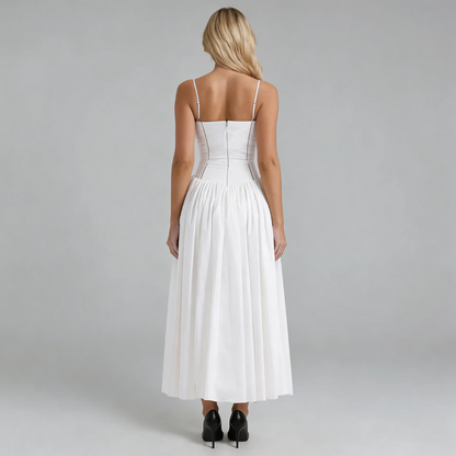 White corset midi dress — back view emphasizing the fitted bodice and flowing skirt.