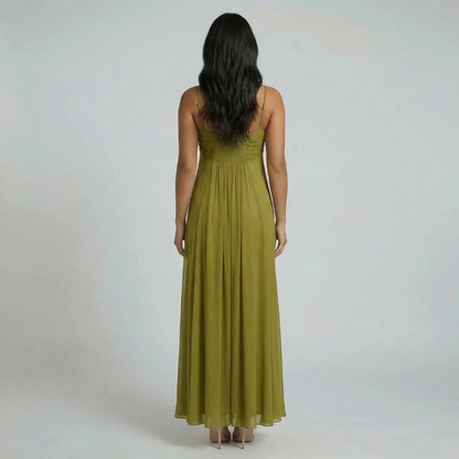 Green ruched maxi dress showing smocked back panel — back view of dress.