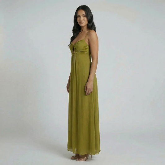 Green keyhole maxi dress with spaghetti straps and a flowy skirt — side view.