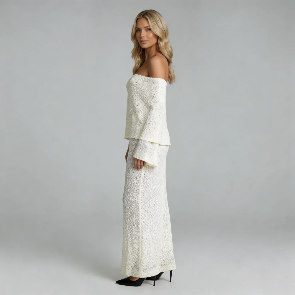 Ivory boucle off-shoulder maxi dress — side view highlighting textured fabric and elegant silhouette.