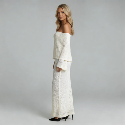 Ivory boucle off-shoulder maxi dress — side view highlighting textured fabric and elegant silhouette.