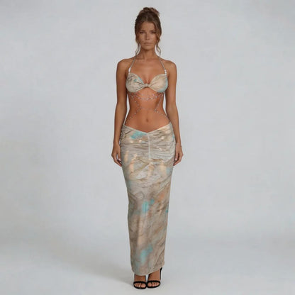 Beige marble print ruched maxi dress with halter neckline and body-chain accents — front view.