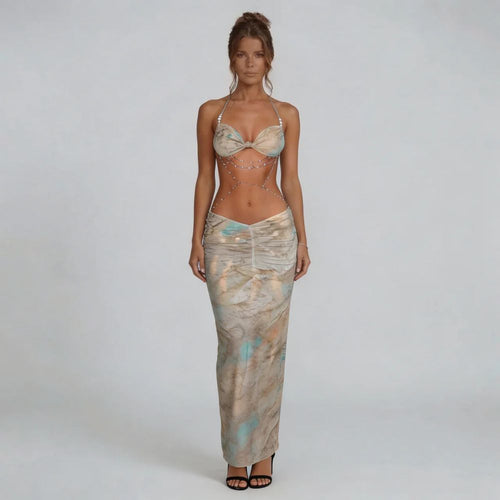 Beige marble print ruched maxi dress with halter neckline and body-chain accents — front view.