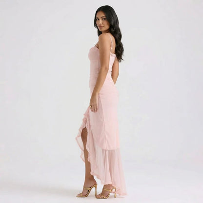 Pink cutout maxi dress with ruched back and flowing overlay — side view