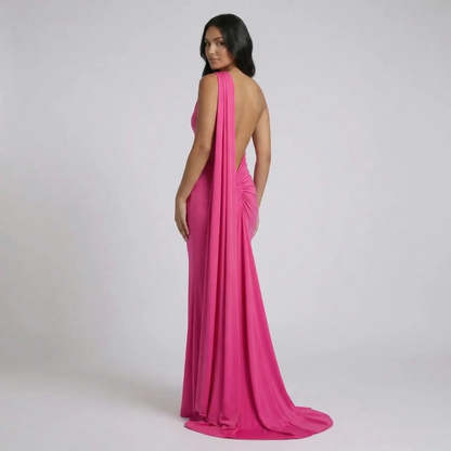 Pink halter maxi dress with ruched detail — back view emphasizing flow