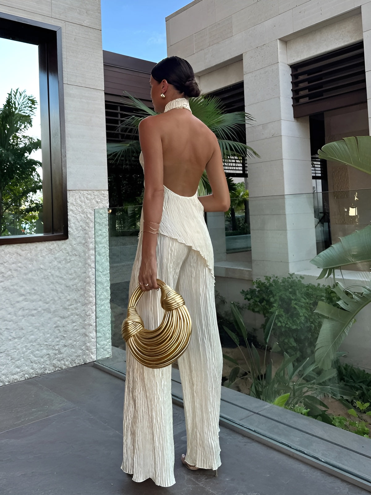 Women halter neck halter pleated jumpsuit, back view