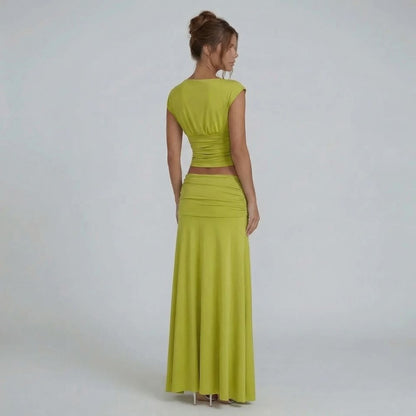 Lime green ruched maxi set — back view highlighting flowing skirt and ruched waist detail.