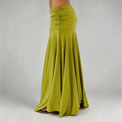 Lime green maxi skirt side view — showcasing ruched detailing and graceful hang of the skirt.