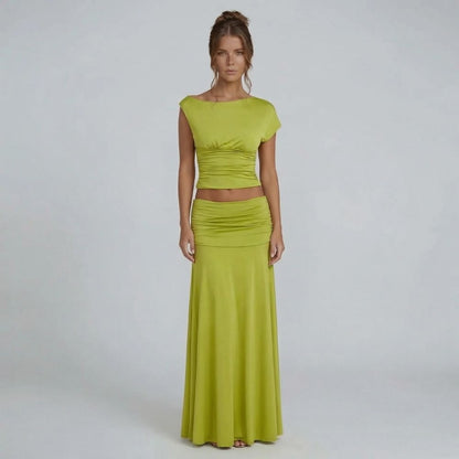 Lime green ruched maxi set with cap sleeve top — front view showcasing elegant boat neckline and floor-length skirt.