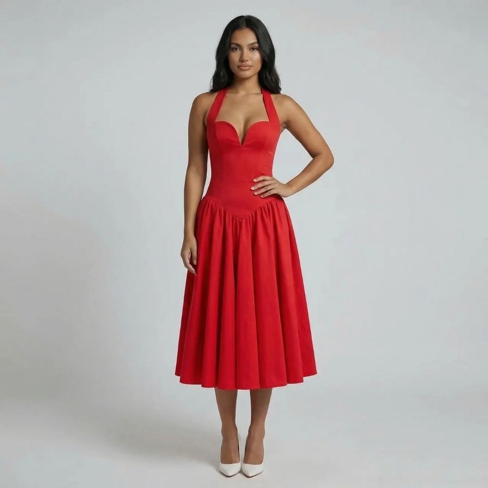 Red corset midi dress with gathered skirt and sweetheart neckline — model styled with nude heels.