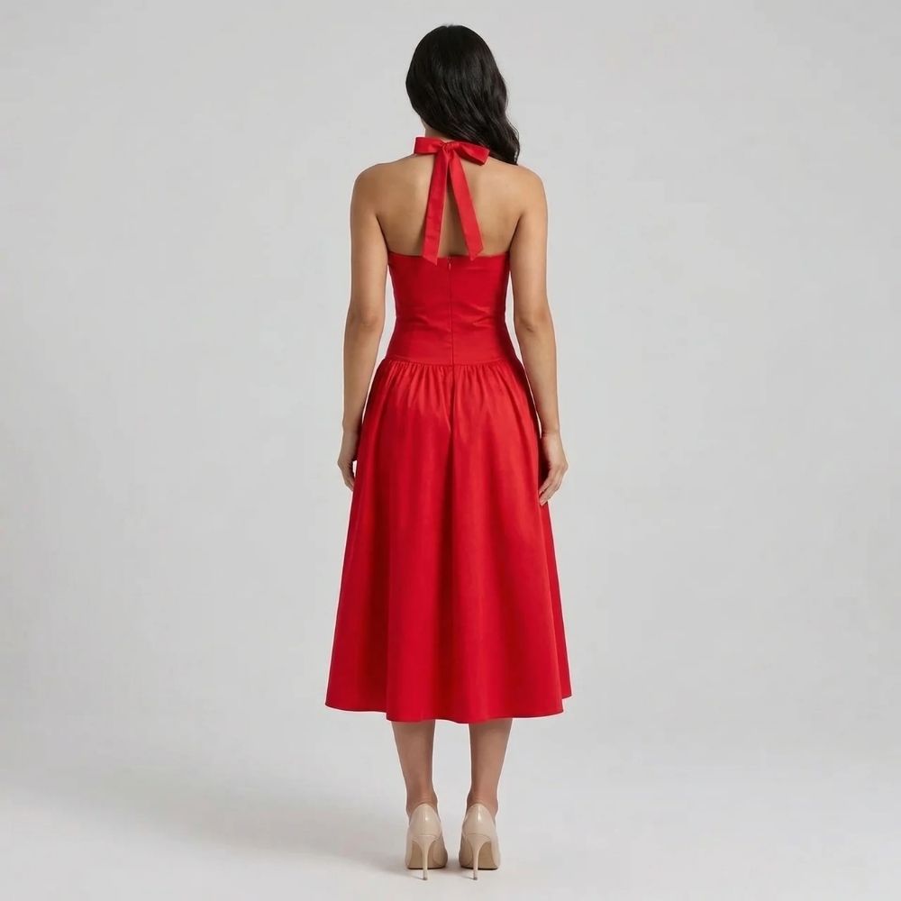 Red corset midi dress — back view highlighting halter tie and fitted bodice design.