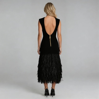 Black fringe midi dress showcasing open V-back with zipper detail.