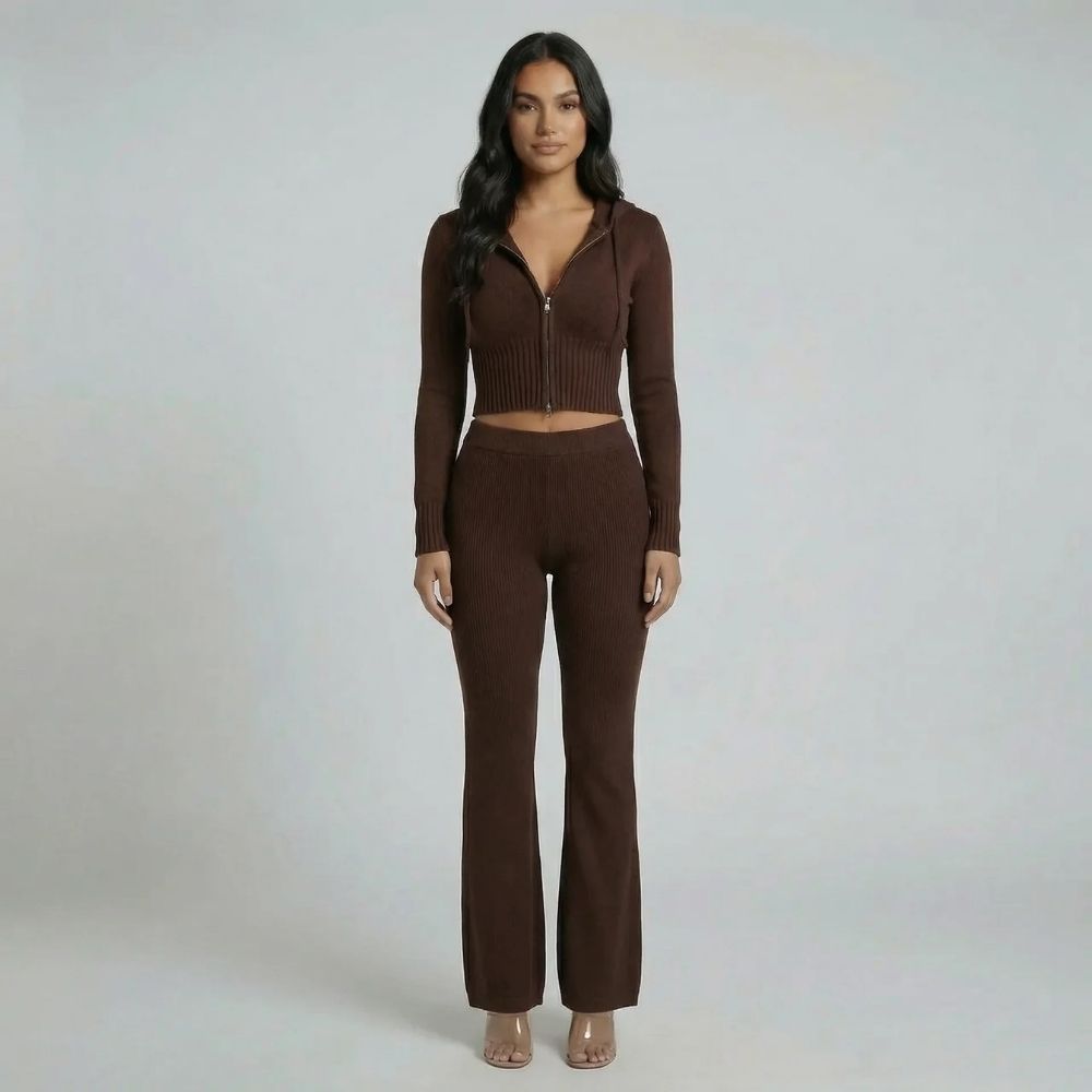 Deep brown ribbed lounge set with cropped zip-up hoodie and high-waisted flared pants — styled with neutral heels.