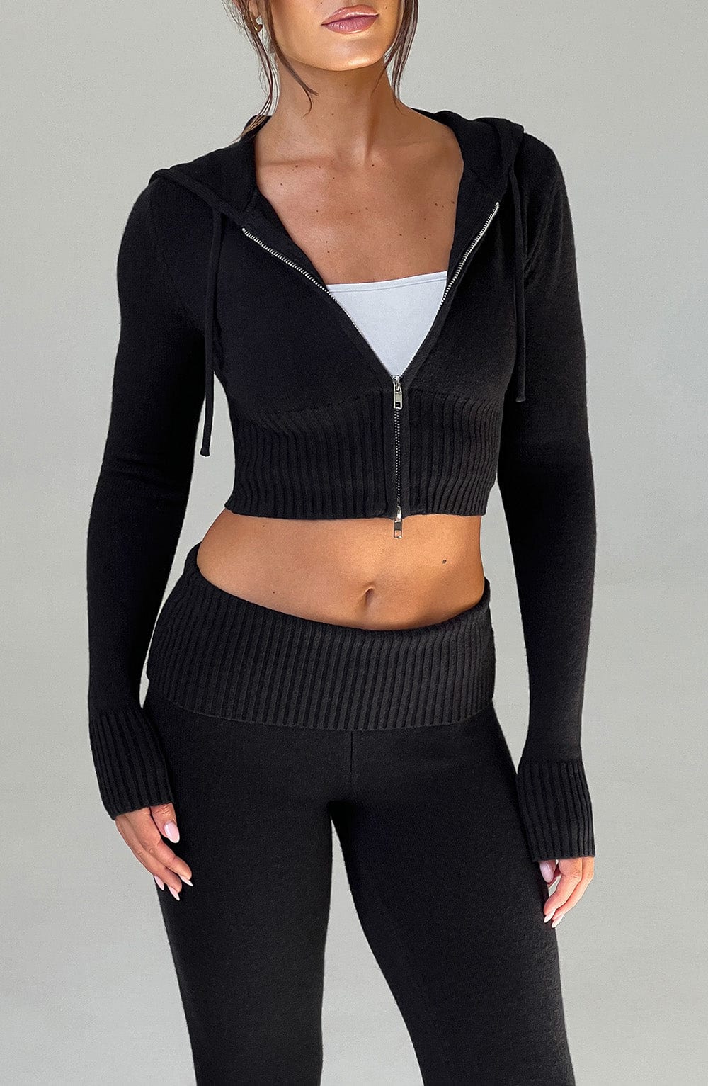 Women black fitted set, detail close-up