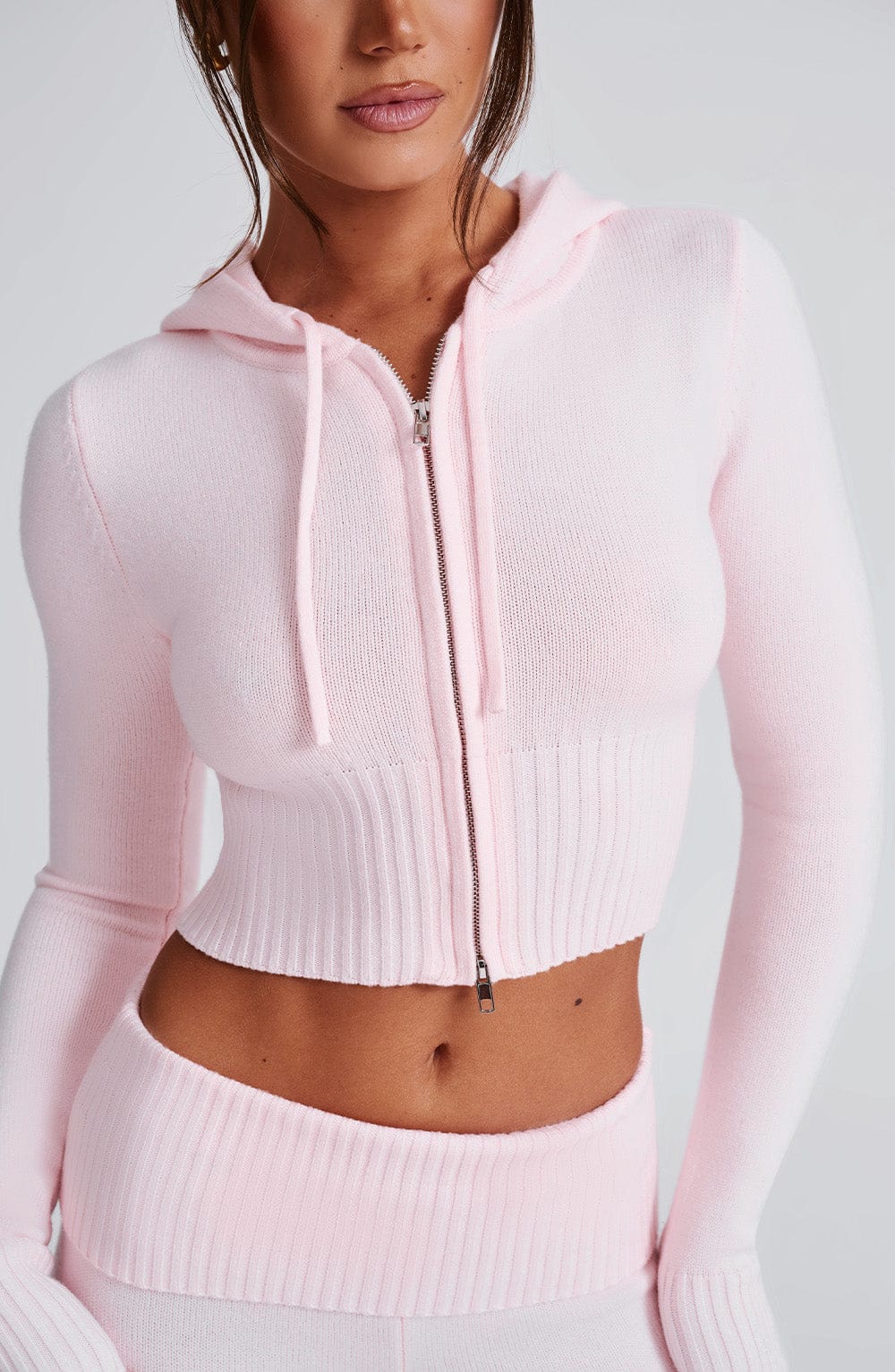 Women pink fitted set, detail close-up