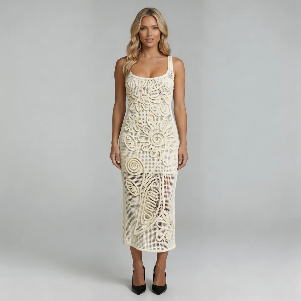 White crochet midi dress with 3D floral appliqué — front view highlighting intricate floral details and open-knit texture.