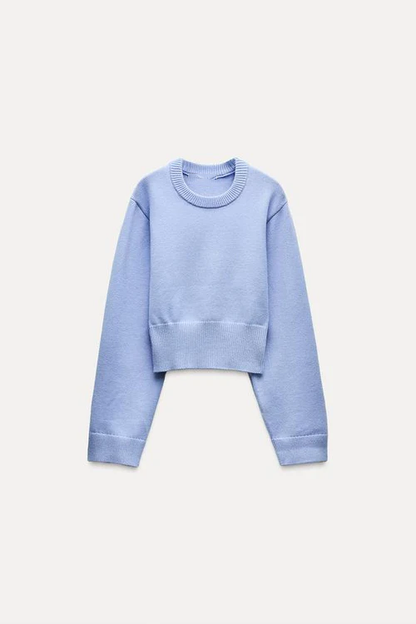 Women light blue crew-neck sweater, side view