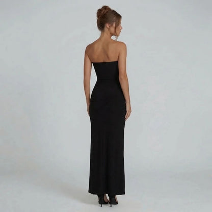 Black strapless maxi dress with floor-length hem and bandeau neckline — back view